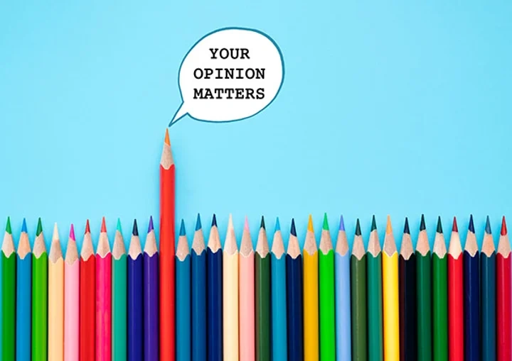 Colored pencils, one pencil has a speech bubble that says "Your Opinion Matters"