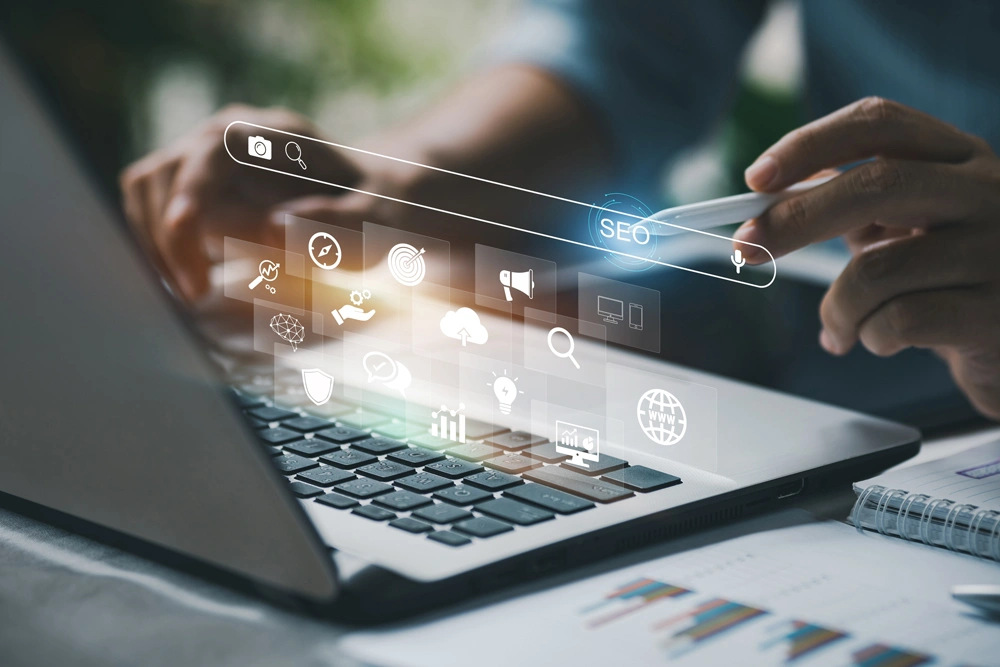 Person working with computer laptop for search engine optimization management