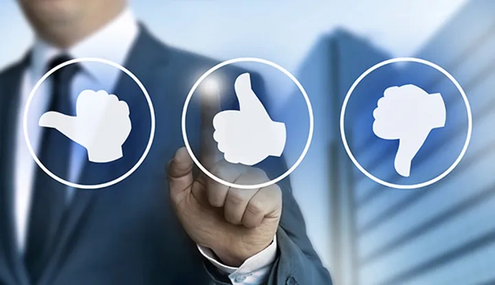 Man touching a thumbs up icon